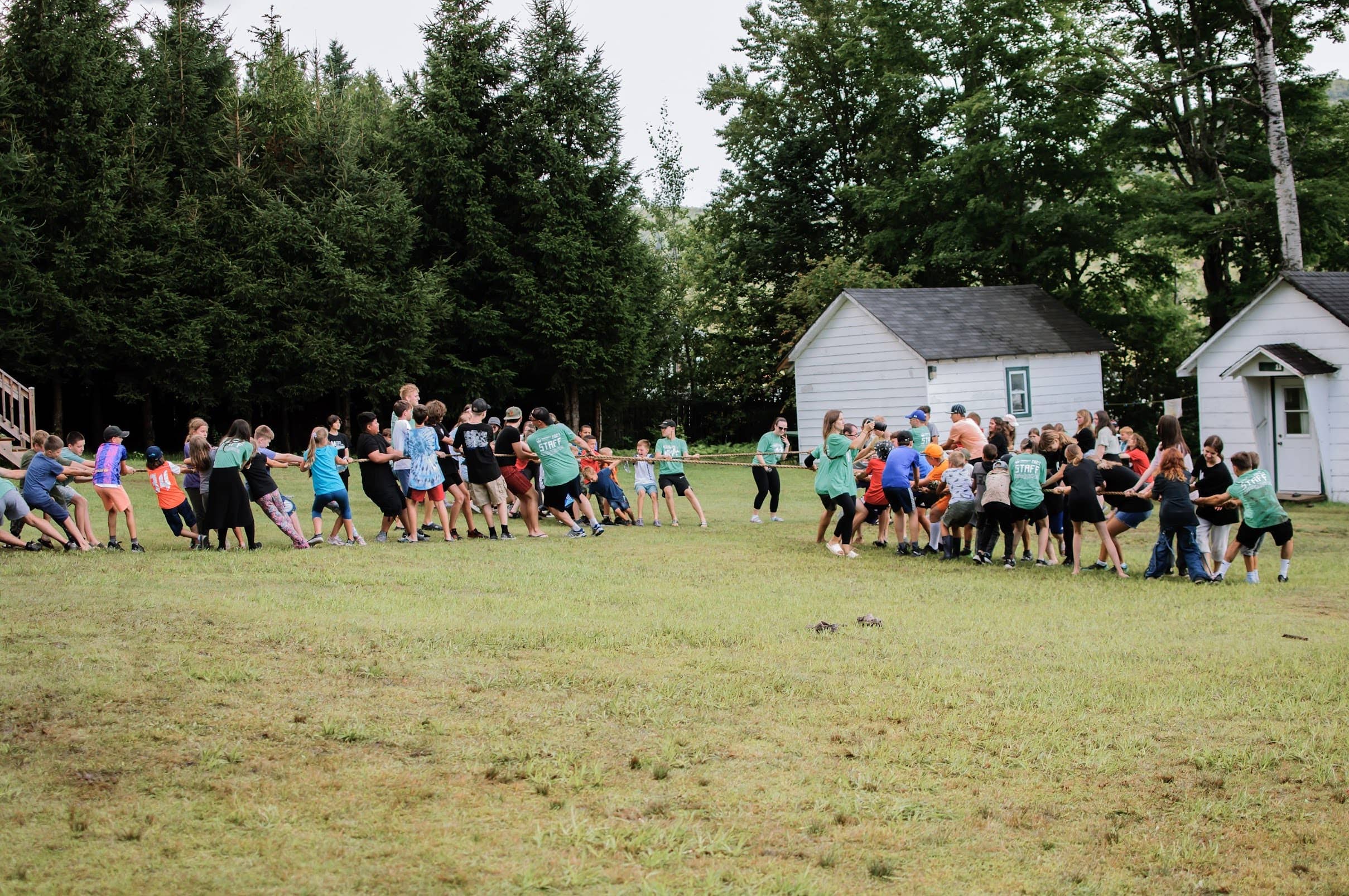 Children's camp playing a camp game all together